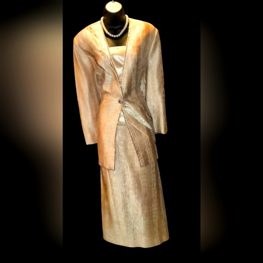 Two piece skirt suit.